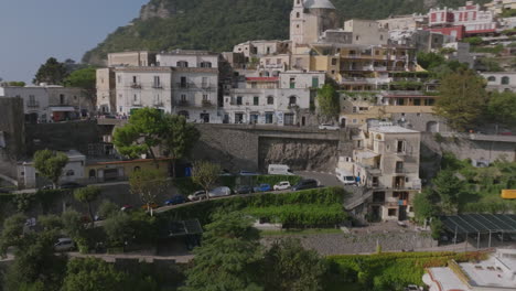 Aerial-footage-flying-alongside-a-curving-mountain-road-outside-the-city-of-Positano,-Italy-on-the-Amalfi-Coast