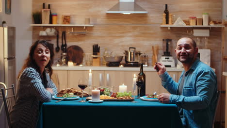 Having-video-call-during-romantic-dinner