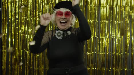 Happy-senior-old-woman-shouting,-celebrating-success,-winning-lottery,-goal-achievement-concept
