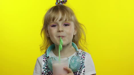 Stylish-happy-child-with-milk-cocktail.-Tourist-drinking-fresh-beverage-milkshake-drink-using-straw