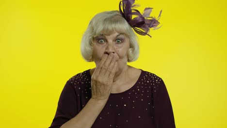 Senior-old-woman-opening-her-mouth-in-amazement,-looking-surprised-shocked.-Slow-motion
