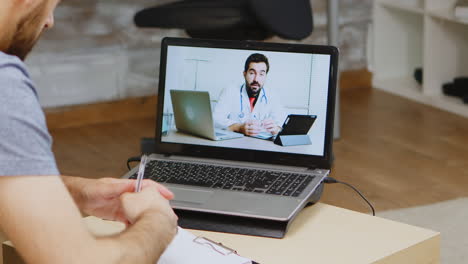 Man-listening-doctor-advice-on-video-call