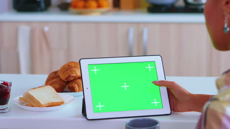 Searching-recipe-on-table-computer-with-green-mockup