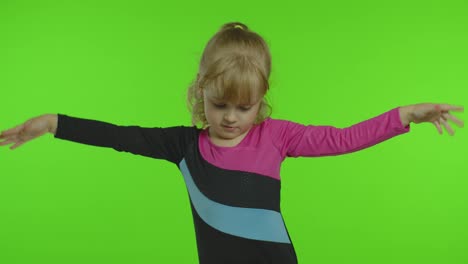 Child-ballerina-exercising-in-studio-on-chroma-key-background.-Girl-kid-dancing,-making-gymnastics