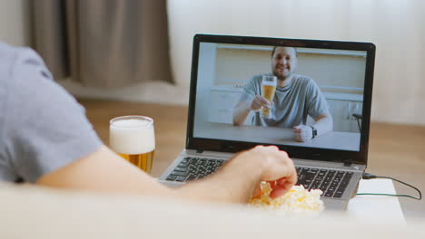 Man-On-Video-Call-Drinking-Beer