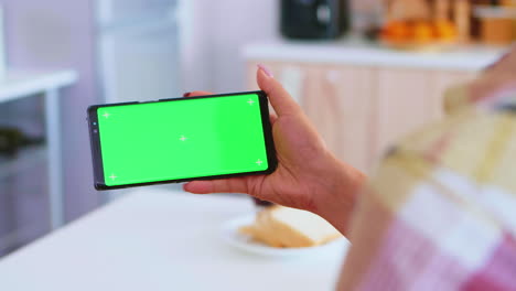 Watching-a-video-on-phone-with-green-screen