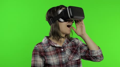 Young-girl-using-VR-app-helmet-to-play-simulation-game.-Woman-watching-virtual-reality-3d-video