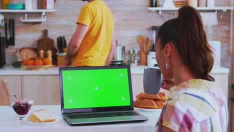 Watching-laptop-with-green-chroma-key