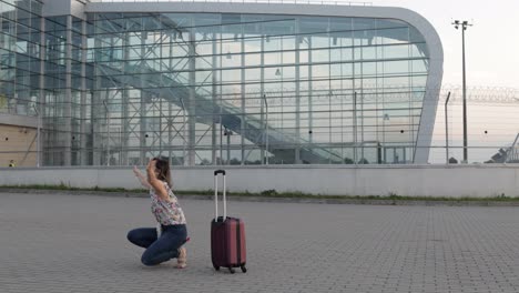 Mother-meet-her-daughter-child-near-airport-terminal-with-open-arms-after-long-flight-vacations-work