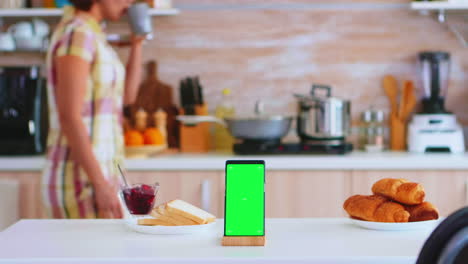 Phone-with-green-screen-next-to-baked-pastry
