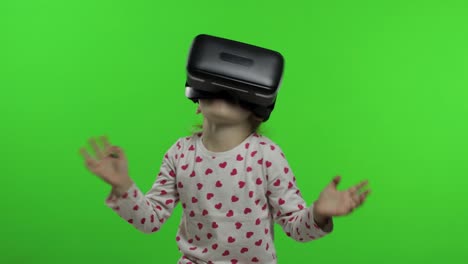 Child-girl-using-VR-app-helmet-to-play-simulation-game.-Watching-virtual-reality-3d-video