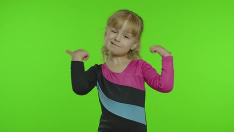 Attractive-kid-ballerina-in-a-silk-tights-show-thumbs-up-in-the-studio-on-chroma-key-background