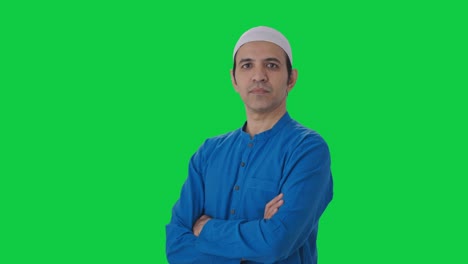 Portrait-of-Confident-Muslim-man-standing-crossed-hands-Green-screen
