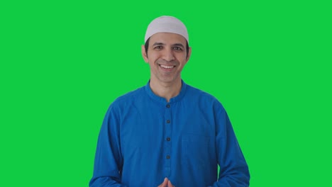 Happy-Muslim-man-talking-to-the-camera-Green-screen