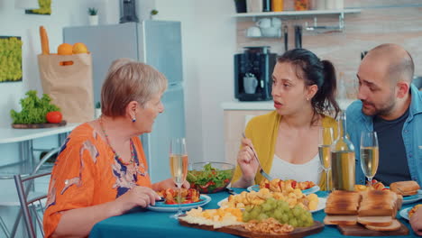 Grandmother-talking-during-dinner