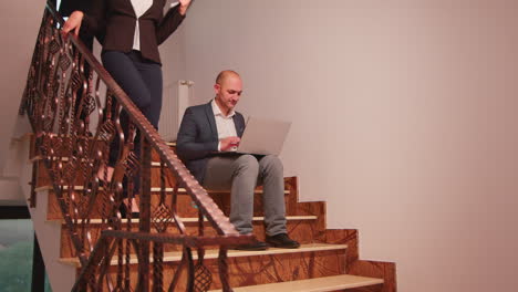Overworked-business-man-smoking-sitting-on-stairs
