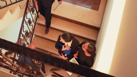 Top-view-of-women-colleagues-meeting-on-stairs