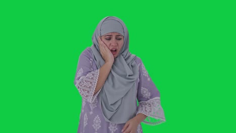 Sick-Muslim-woman-suffering-from-Tooth-pain-Green-screen
