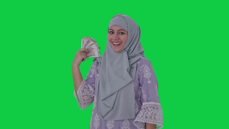 Feliz-Dinero-De-Mujer-Musulmana-Como-Pantalla-Verde-De-Ventilador
