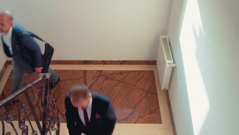 Top-view-of-businesspeople-moving-on-office-stairs