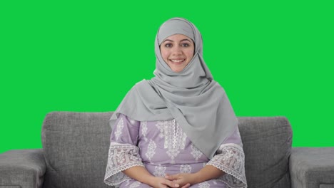 Happy-Muslim-woman-smiling-to-the-camera-Green-screen