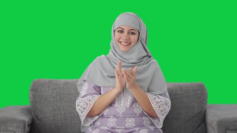 Happy-Muslim-woman-clapping-and-appreciating-Green-screen