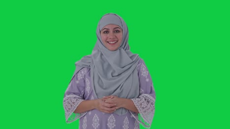 Happy-Muslim-woman-talking-to-the-camera-Green-screen