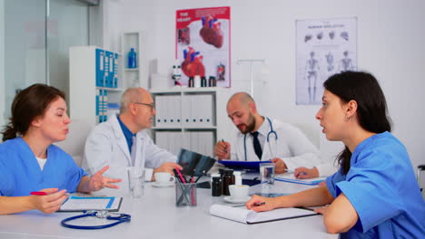 Medical-nurses-having-meeting-with-doctors-in-white-lab-coats