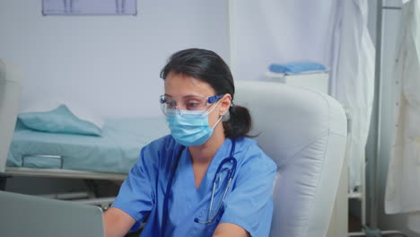 Ward-assistant-having-protection-mask-and-glasses