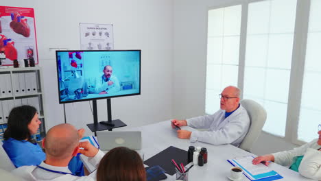 Team-of-medical-staff-discussing-during-video-conference