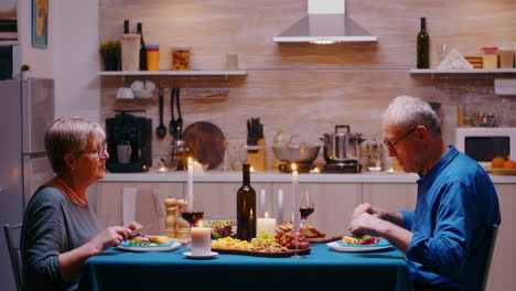 Old-couple-having-romantic-dinner