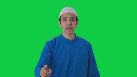 Angry-Muslim-man-stopping-someone-from-doing-wrong-Green-screen