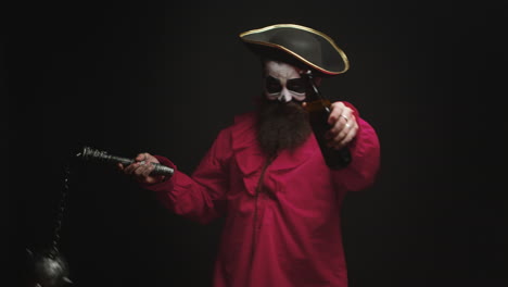 Man-dressed-up-like-a-drunk-pirate-over-black-background