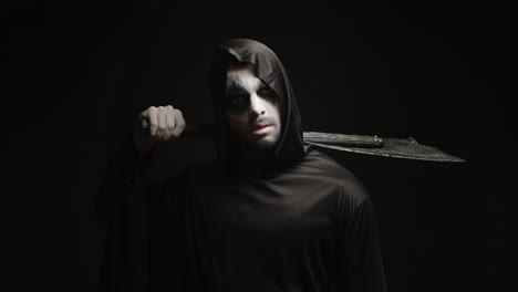 Grim-reaper-over-black-background-with-axe-in-his-hands
