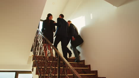 Business-workers-walking-up-on-stairs