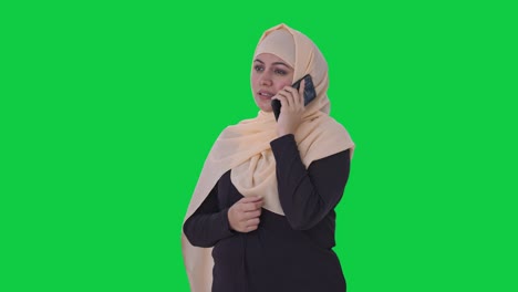 Muslim-woman-talking-on-phone-Green-screen
