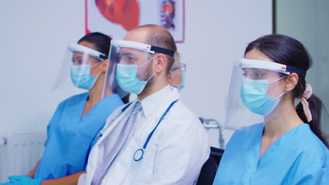 Medical-personnel-with-face-mask-in-hospital-waiting-area
