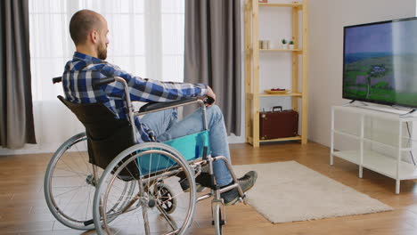 Paralysed-young-man-watching-tv