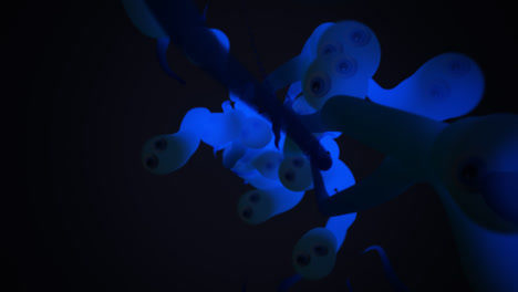 Underwater-wildlife.-Close-up-animation-of-a-group-of-many-blue,-translucent-worms-or-tadpoles-or-sperm-cells-spawning-from-one-spot-and-actively-crawling-forward.