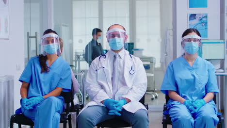 Team-of-medical-staff-with-protection-mask-and-visor