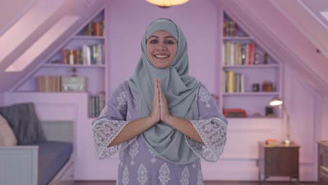 Happy-Muslim-woman-doing-Namaste