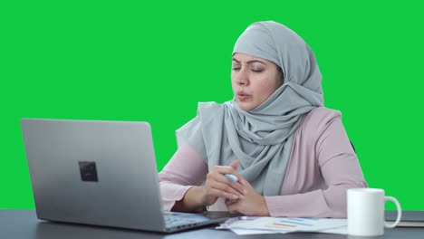 Muslim-businesswoman-doing-online-meeting-Green-screen