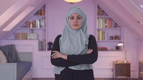 Confident-Muslim-woman-standing-crossed-hands