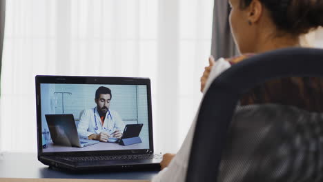 Female-patient-in-a-video-call-with-her-therapist
