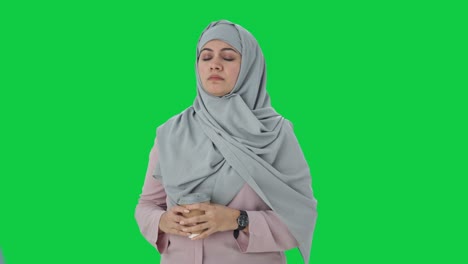 Muslim-businesswoman-waiting-for-someone-Green-screen