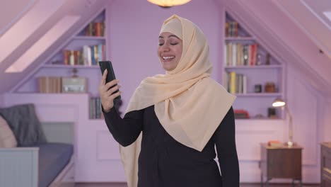 Happy-Muslim-woman-talking-on-video-call