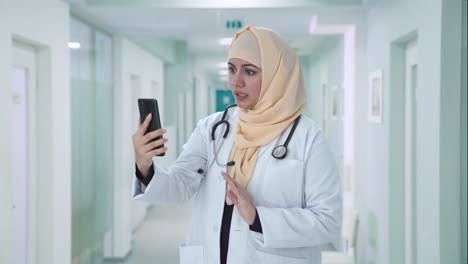 Muslim-doctor-talking-on-video-call