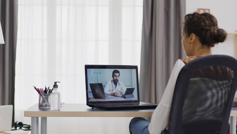 Woman-in-a-remote-video-call-with-her-doctor