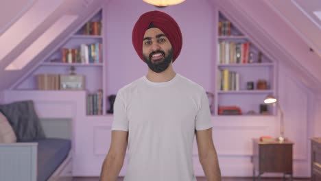 Happy-Sikh-Indian-man-lifting-heavy-dumbbells
