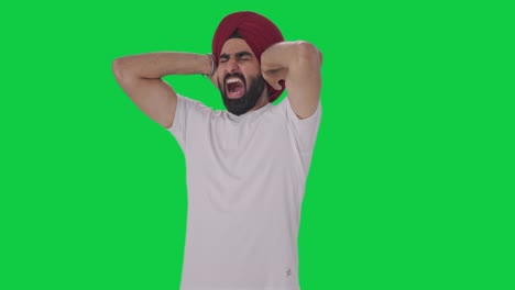 Un-Hombre-Indio-Sikh-Enojado-Desafiando-A-Alguien-A-Luchar-Contra-La-Pantalla-Verde